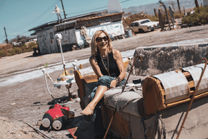 Brook Dougherty Salton Sea on couch with lotion